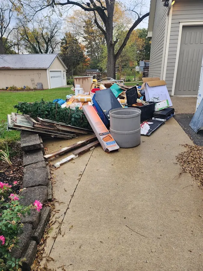 Dumpster being loaded with debris for Residential Dumpster Rental in Jupiter